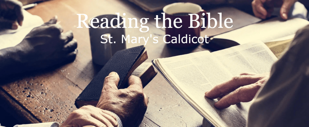 A close up picture of people sat at a table reading the Bible